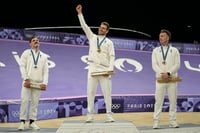 | Photo: AP/Thibault Camus : Men's BMX racing medal ceremony: Gold medalist Joris Daudet, Sylvain Andre and Romain Mahieu